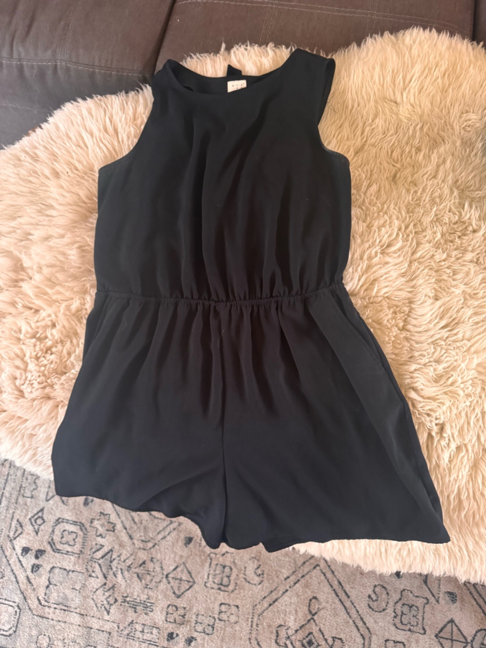 Black romper with peekaboo back detail